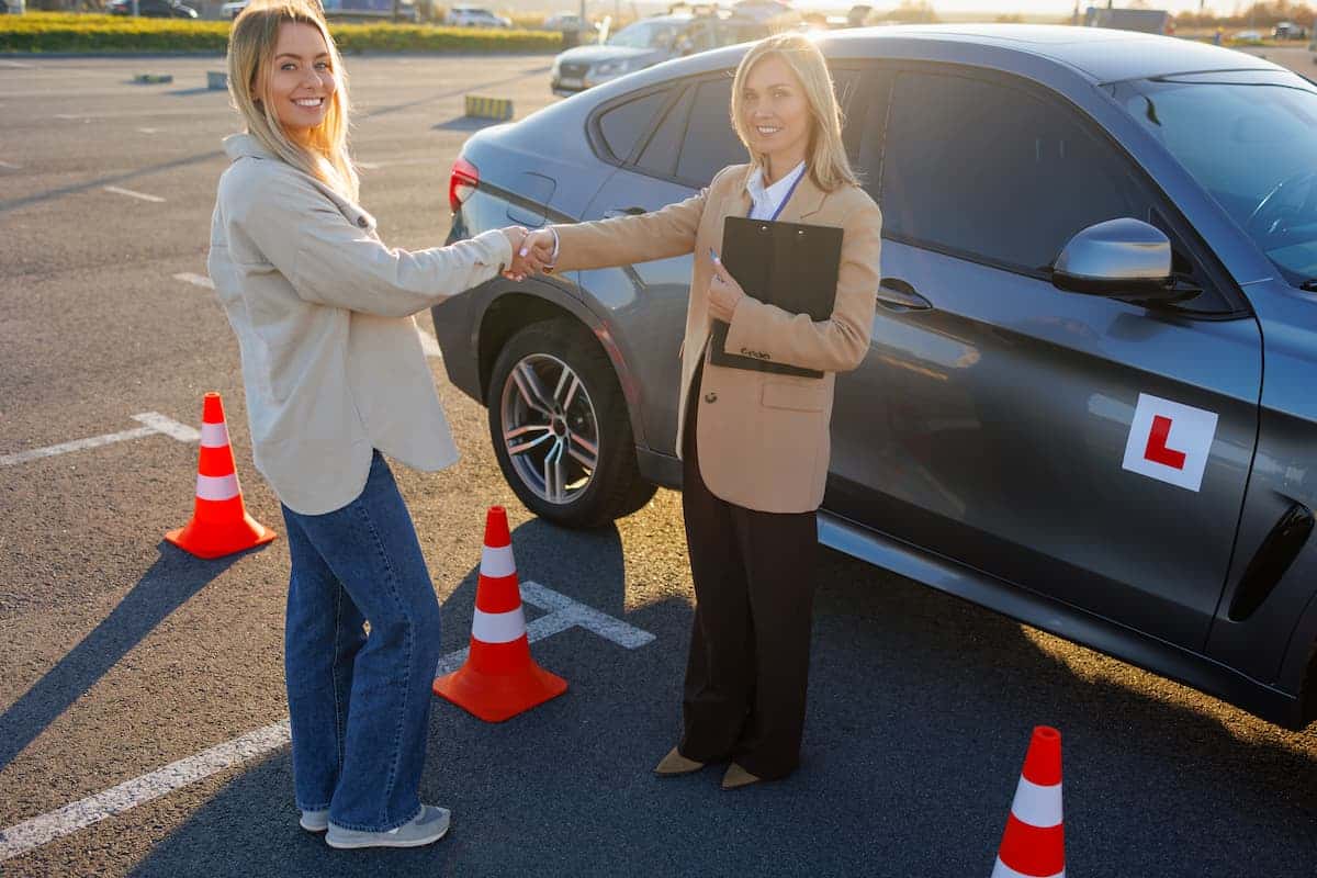 Female automatic driving instructor teaching a learner on local roads in Manchester and Cheshire East with Bee Drive