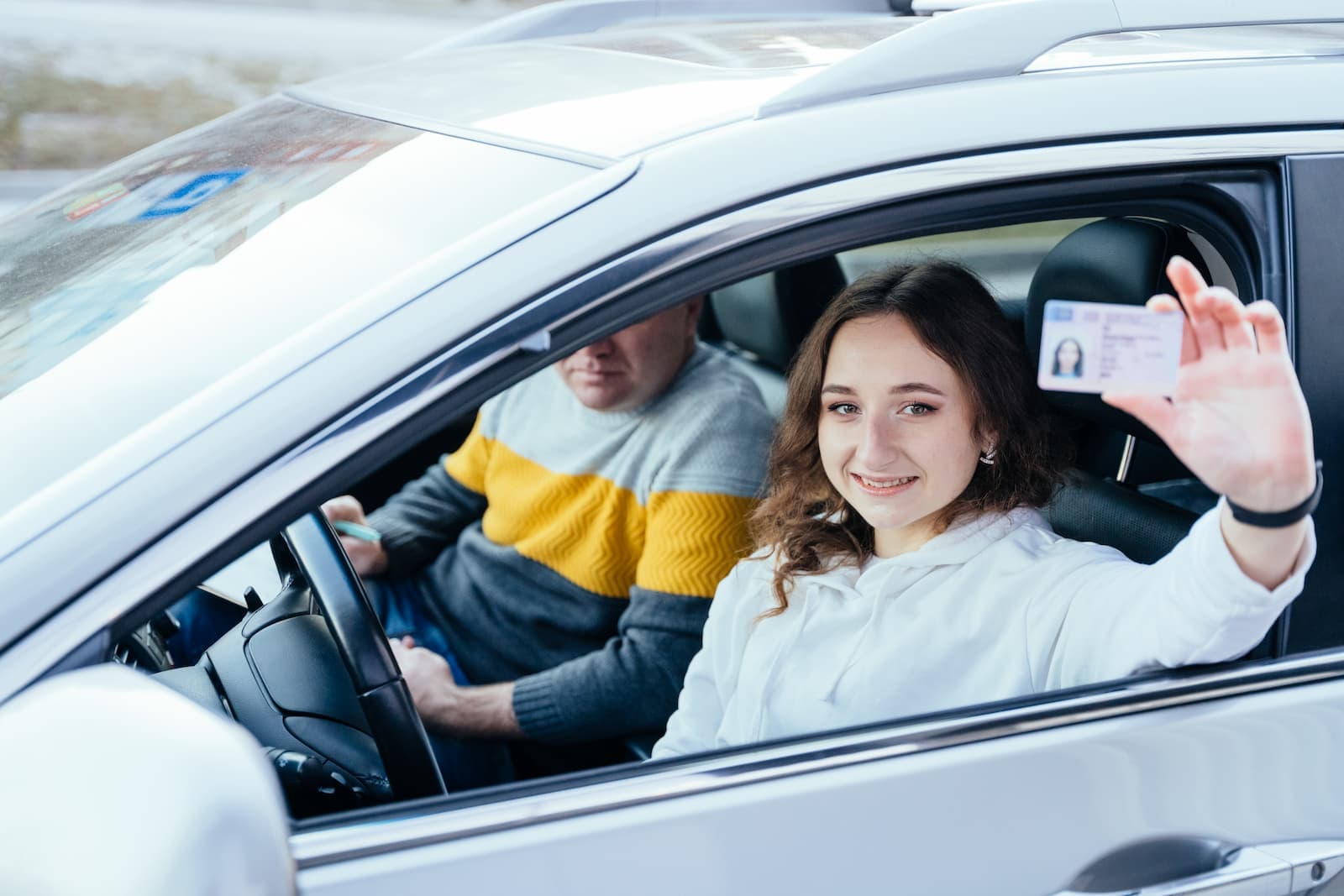 Student celebrating passing their driving test